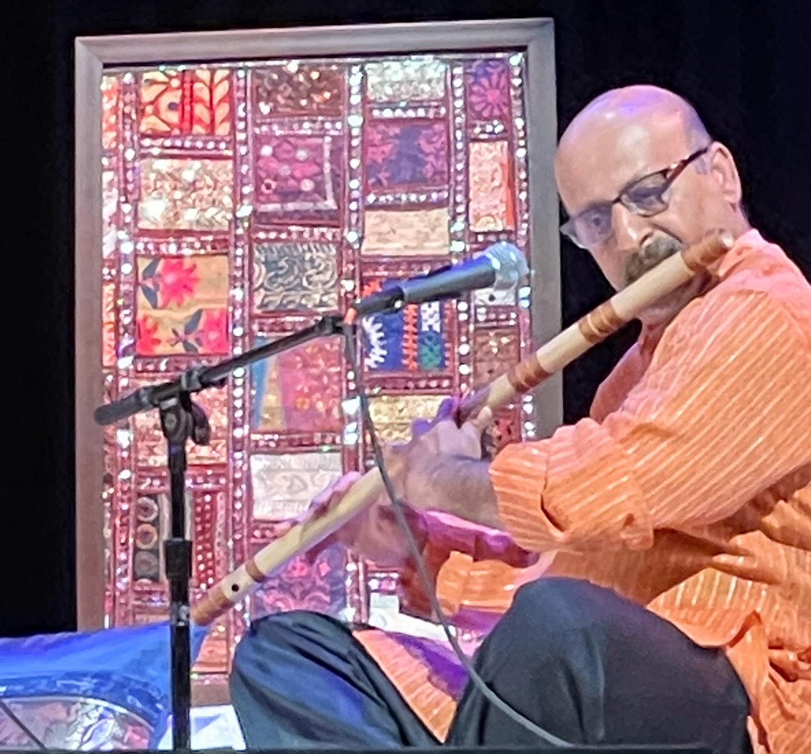 Mahesh Lachyankar playing the bansuri on stage